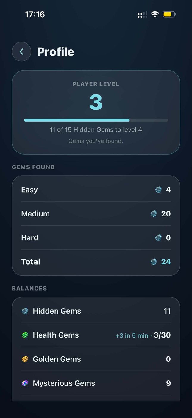 The profile screen: player level with progress to the next, gems found on easy, medium and hard, and the current balances.